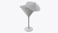 Martini glass with olive and umbrella