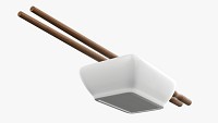 Soy sauce in bowl and chopsticks