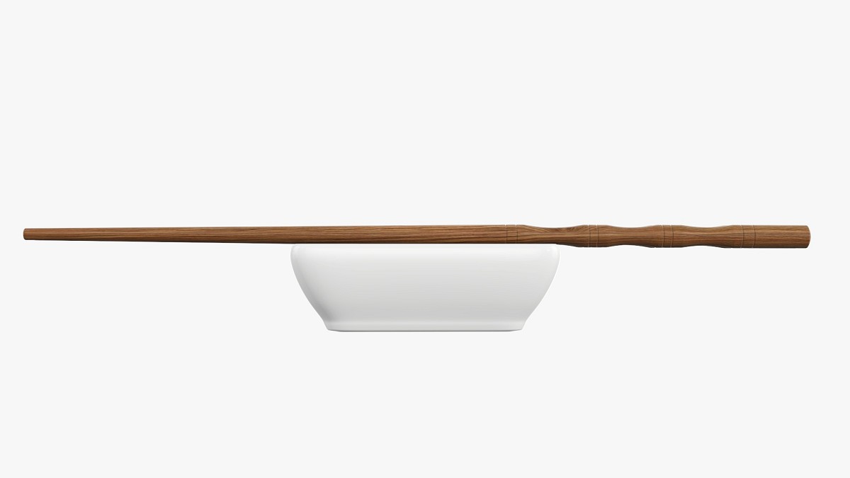 Soy sauce in bowl and chopsticks