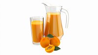 Jug and glass with apricot juice and fruit