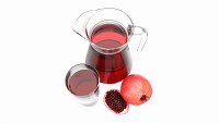 Jug and glass with pomegranate juice and fruit