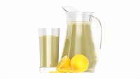 Jug and glass with lemon juice and fruit