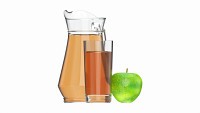 Jug and glass with apple juice and fruit