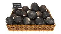 Black radish in tray with price tag