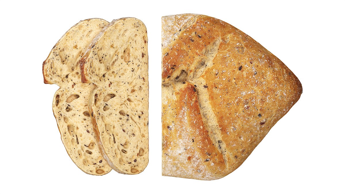 Loaf of artisanal white bread cutted